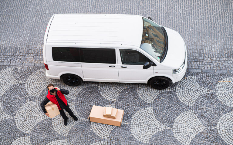 Aerial View Of Delivery Man Courier With Face Mask 2023 11 27 05 17 12 Utc 768x479, ViKoeberBiler.dk